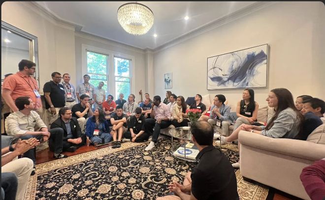 Founders gathered in a living room at a MITAS founder dinner